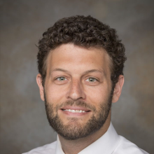 Headshot of Aaron Alexander-Bloch.