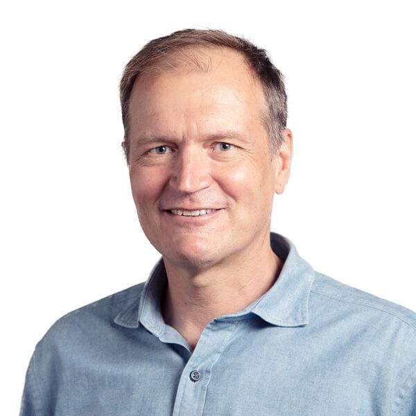 Portrait of Dr. Karel Svoboda, smiling and looking directly at the camera, image courtesy of AllenInstitute.org